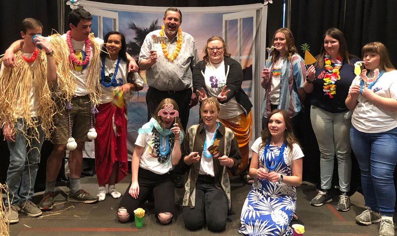 student government at a hawaiian activity with leighs and skirts and fruite necklaces