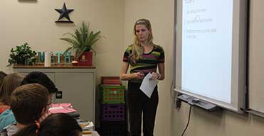 Teacher teaching a class.